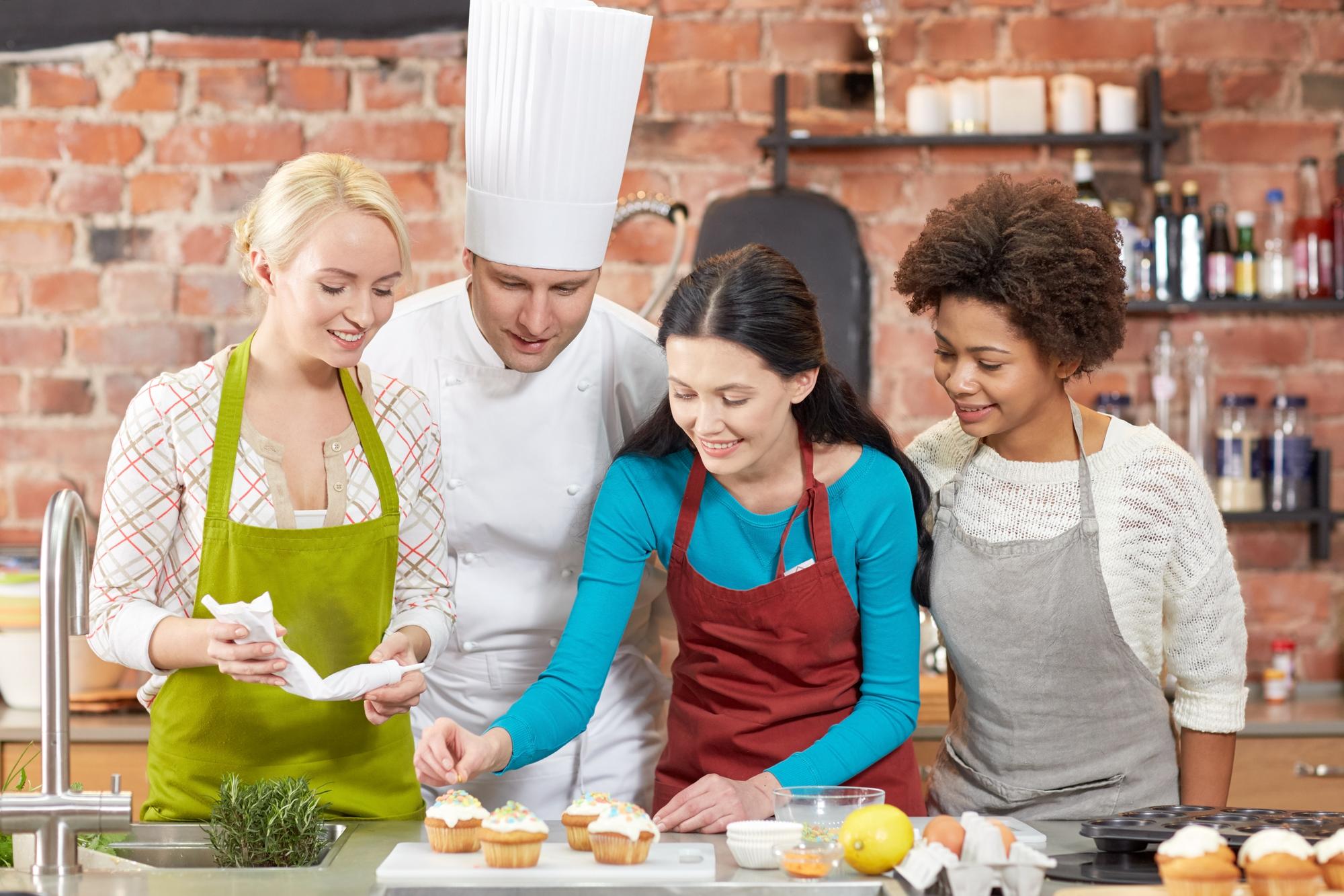 Local chef teaching a small group in a bright kitchen